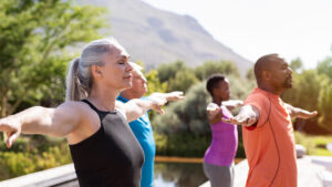 small group of people doing breathing and standing